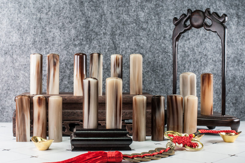 給寶貝最重要的紀念禮物，選擇台南唯原工藝肚臍章、胎毛筆，提供最多的材質、完善的服務。花赤牛角 金漆 肚臍章 單章/對章組合，買肚臍張就來唯原工藝!